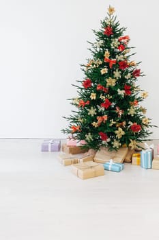 Beautiful holdiay decorated room with Christmas tree with presents under it