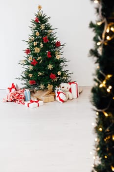 Beautiful decorated room with Christmas tree with presents under it. New year background