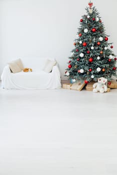 Beautiful holdiay decorated room with Christmas tree with presents under it