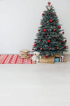 Beautiful decorated room with Christmas tree with presents under it