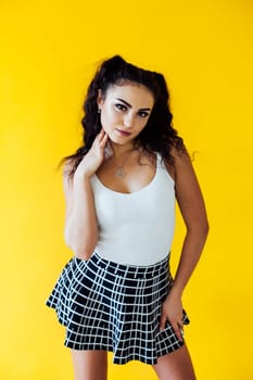 Portrait of a beautiful brunette woman in a white T-shirt