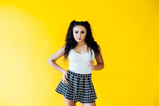 Portrait of a beautiful brunette woman in a white T-shirt