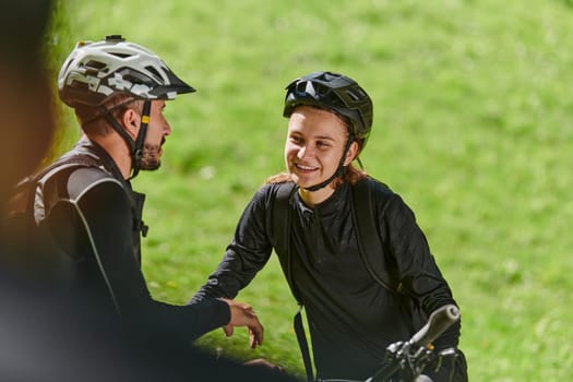 A sweet couple, equipped with bicycles and engrossed in coordinating their journey, checks their GPS mobile and watches while planning scenic routes in the park, seamlessly blending technology and outdoor adventure for a delightful cycling experience.