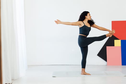 brunette woman engaged in yoga asana gymnastics fitness flexibility body