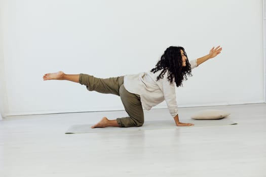 Brunette woman engaged in yoga asana flexibility body