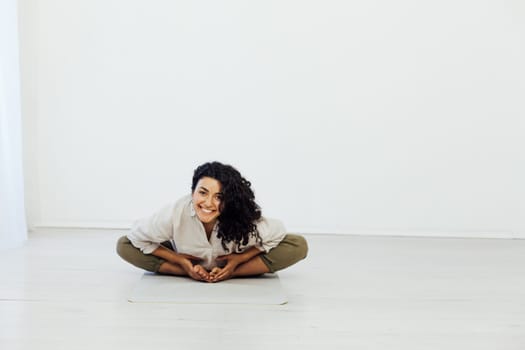 Brunette woman engaged in yoga asana flexibility body