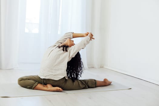 Brunette woman engaged in yoga asana flexibility body