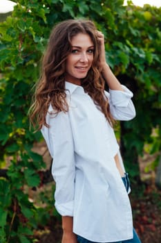 fashionable woman in the vineyards for wine