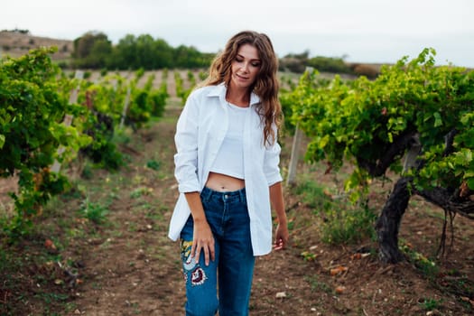 fashionable woman in the vineyards for wine