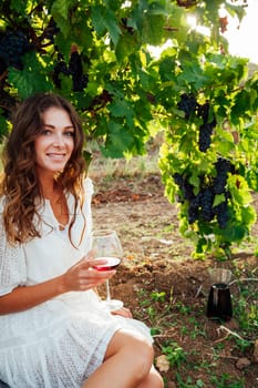 woman in white dress in vineyards for wine