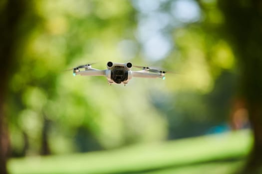 Professional drone filming the park on a sunny day.