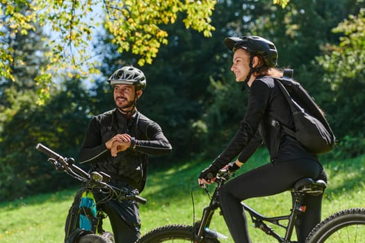 A sweet couple, equipped with bicycles and engrossed in coordinating their journey, checks their GPS mobile and watches while planning scenic routes in the park, seamlessly blending technology and outdoor adventure for a delightful cycling experience.