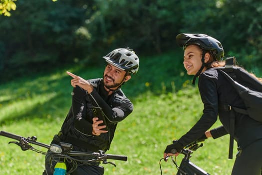 A sweet couple, equipped with bicycles and engrossed in coordinating their journey, checks their GPS mobile and watches while planning scenic routes in the park, seamlessly blending technology and outdoor adventure for a delightful cycling experience.