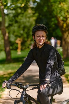 In the radiant embrace of a sunny day, a modern woman revels in the joy of cycling, her sleek bicycle and professional gear complementing her active lifestyle as she rides through the park, epitomizing a perfect blend of style and outdoor vitality.