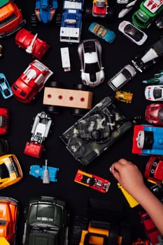 lots of baby car toys for games as a backdrop