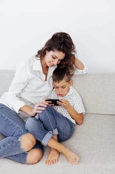 Mom and son watch smartphone games