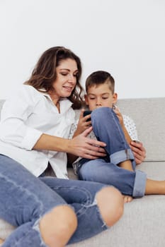 Mom and son watch smartphone games