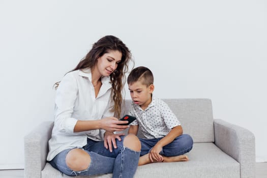 Mom and son watch smartphone games