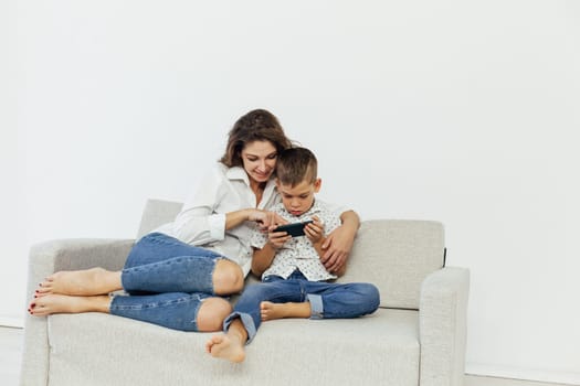 Mom and son watch smartphone games