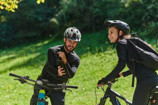 A blissful couple, adorned in professional cycling gear, enjoys a romantic bicycle ride through a park, surrounded by modern natural attractions, radiating love and happiness.