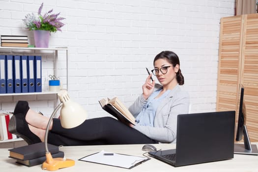 business girl works at a computer in the Office 1