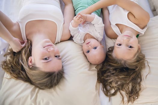 children of three sisters in the morning on the bed in the bedroom 1