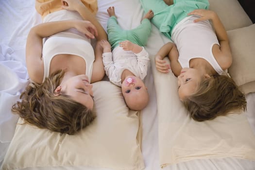 children of three sisters in the morning on the bed in the bedroom 1