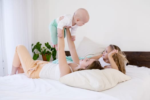 children of three sisters in the morning on the bed in the bedroom 1