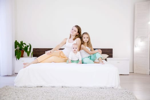 children of three sisters in the morning on the bed in the bedroom 1