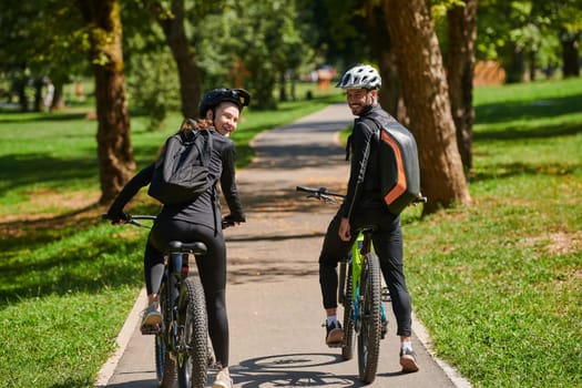 A blissful couple, adorned in professional cycling gear, enjoys a romantic bicycle ride through a park, surrounded by modern natural attractions, radiating love and happiness.