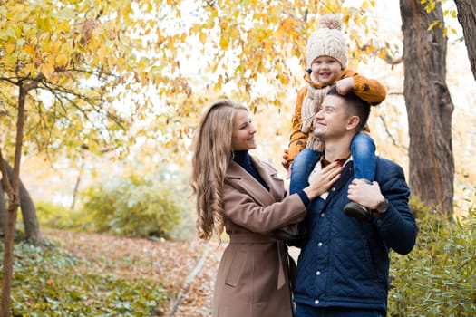 family to boys walk on autumn Woods 1