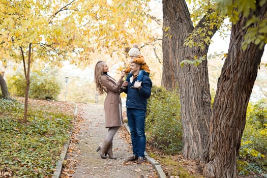 family to boys walk on autumn Woods 1