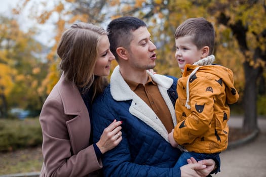 family mom dad son portrait with happiness in the forest 1