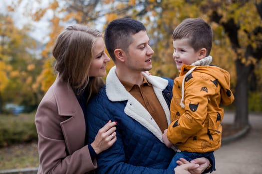 family mom dad son portrait with happiness in the forest 1