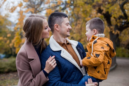 family mom dad son portrait with happiness in the forest 1