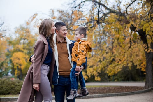 family mom dad son portrait with happiness in the forest 1