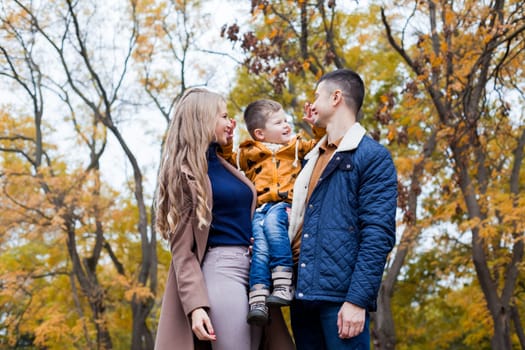 Happy family walks through the Park Winter forest 1