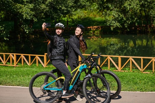 A modern couple captures the joy of their bike ride in the park through a trendy selfie, blending technology and outdoor adventure to immortalize a moment of happiness and togetherness.