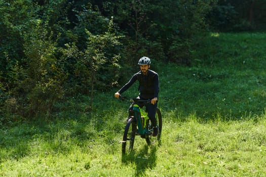 In the radiant glow of a sunny day, a fitness enthusiast, donned in professional gear, pedals through the park on his bicycle, embodying strength and vitality in a dynamic outdoor workout.