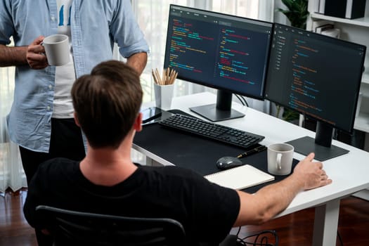 IT developers discussing online software development information on pc screen, creating program coding for latest version application on website. Concept of brainstorming firmware updated. Sellable.