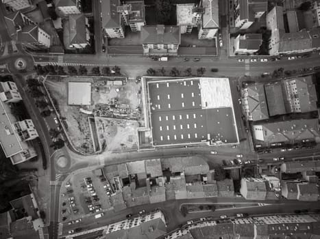 aerial view drone shot of grocery supermarket construction site in Cremona, Italy