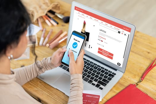 Woman shopping online on internet marketplace browsing for sale items for modern lifestyle and use credit card for online payment from wallet protected by crucial cyber security software