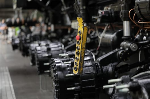 Control panel with buttons in production of car parts and engines. Concept of car repair workshop and industrial production of engines and spare parts