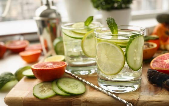 Lime with cucumber punch and mint homemade cocktail closeup. Chilled summer cocktail concept