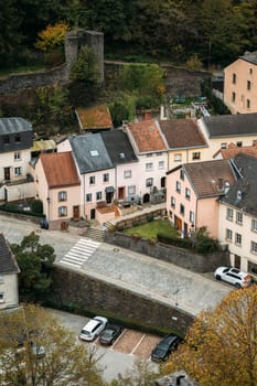 Double story semi-detached cottages with parking area and main road in Luxemburg. Old town with well-developed infrastructure shielded from forest by stone fortress wall