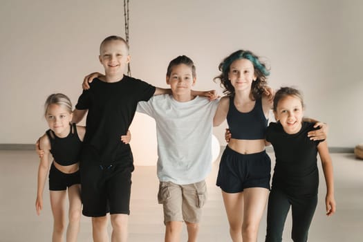 Portrait of a group of children in the fitness room. Children's yoga.