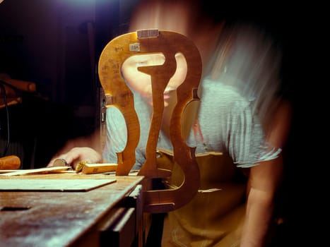 High quality photoartisan violin maker luthier working with violin mould for center bot, corner blocks , bend ribs for a handmade violin