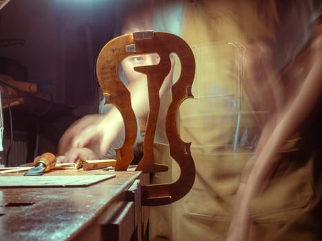 High quality photoartisan violin maker luthier working with violin mould for center bot, corner blocks , bend ribs for a handmade violin