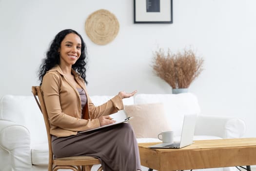 Psychologist woman in clinic office professional portrait with friendly smile feeling inviting for patient to visit the psychologist. The experienced and confident psychologist is crucial specialist