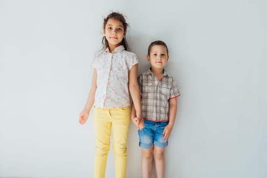 Boy brother and sister holding hands